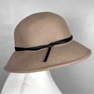 A New Day 100% wool women’s hat with adjustable inner band.